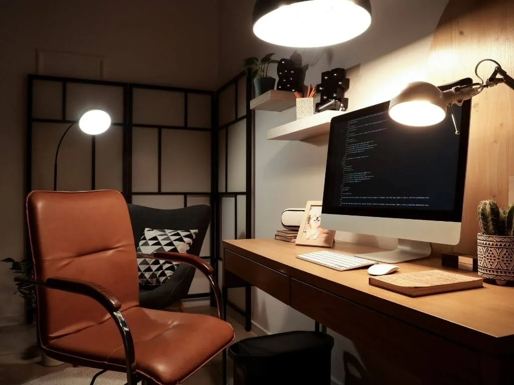a home office setup with ergonomic chair and table